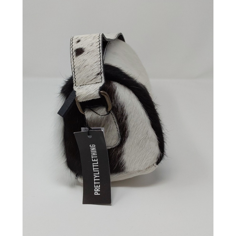 PrettyLittleThing Cow Print Hair On Leather Shoulder Bag Black White Mini